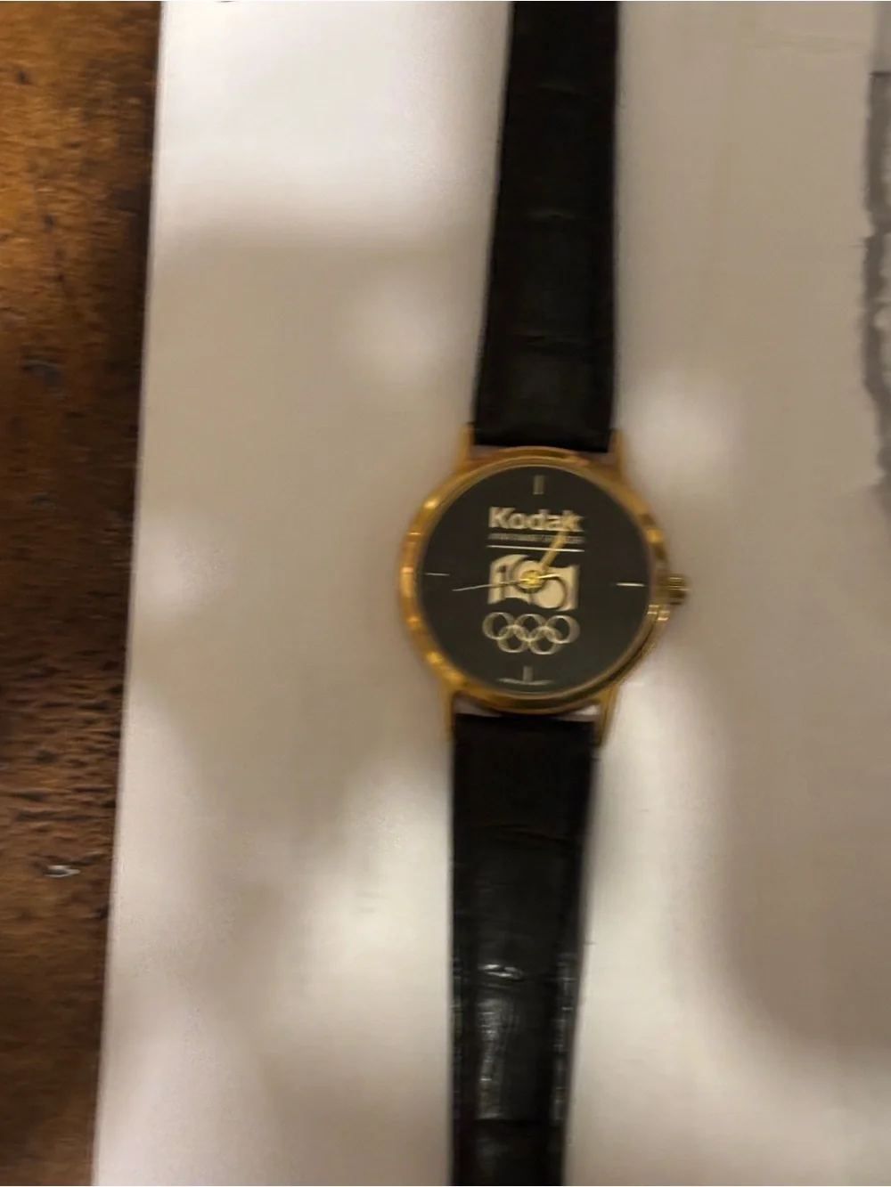 Kodak Gold and Black Kodak Logo Dress Watch